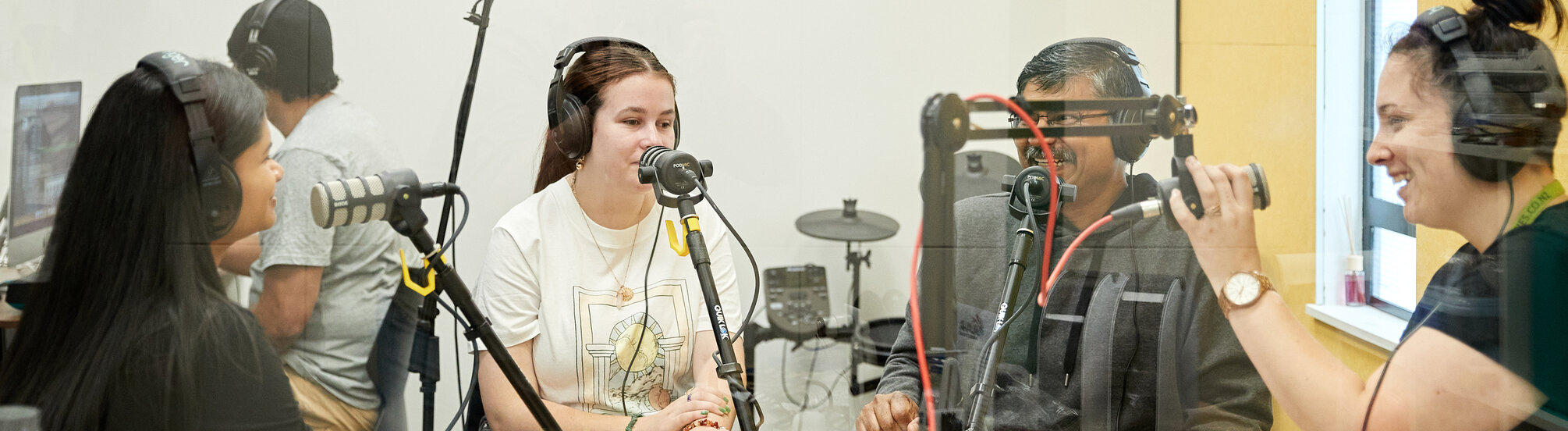 Image of a group of people in a recording studio